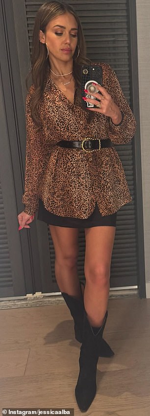 The fashionista modeled two different outfits in mirror selfies, including a leopard print shirt and mini skirt
