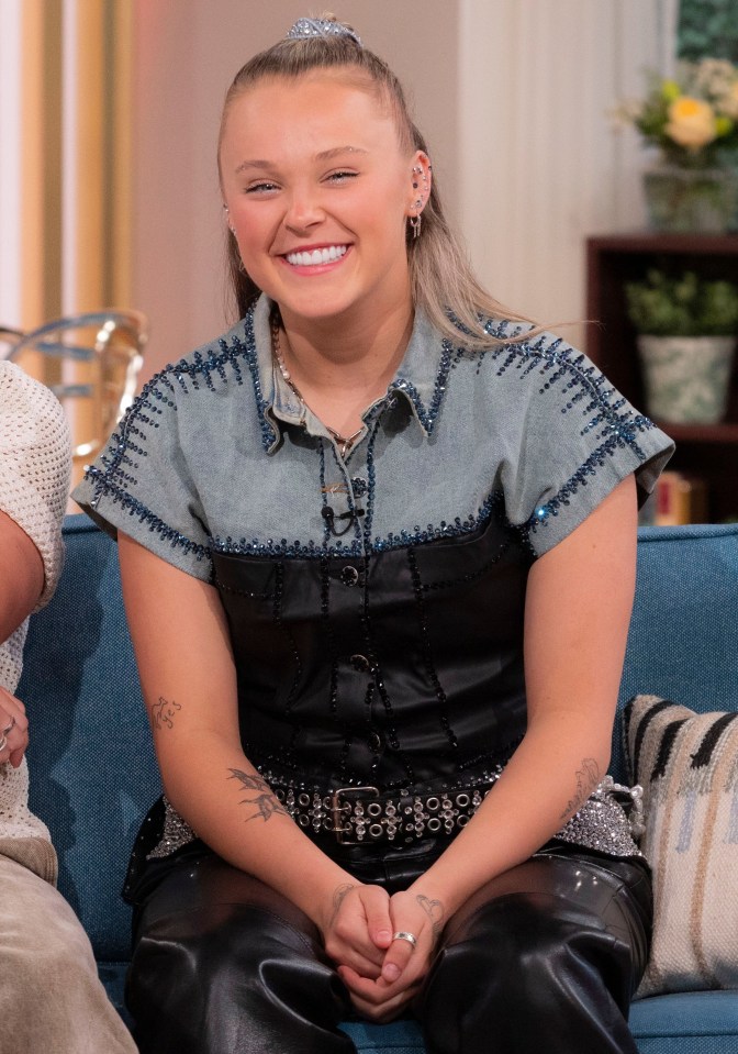 Chris Hughes and JoJo Siwa on a TV show.