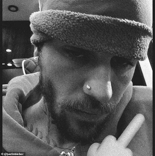 One of Justin¿s Father¿s Day photos with a rude emoji