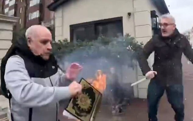 Hamit Coskun burns a copy of the Koran outside the Turkish consulate in Knightsbridge, London, on February 13