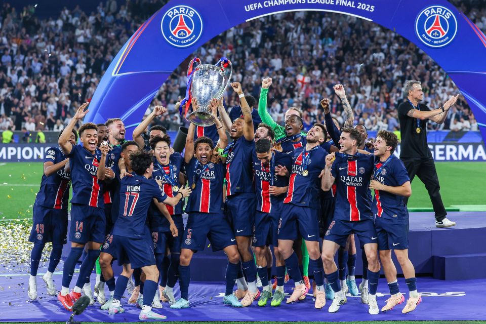Paris Saint-Germain players celebrating with the UEFA Champions League trophy.