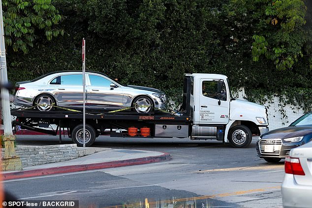 Kanye West, 48, was dealing with the inconvenience of having his vehicle towed, as a photographer snapped images of the rapper's custom Maybach being hauled away from the Château Marmont on Tuesday