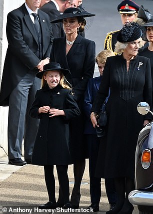 Kate¿s black coat was by Alexander McQueen and Charlotte¿s by Ancar