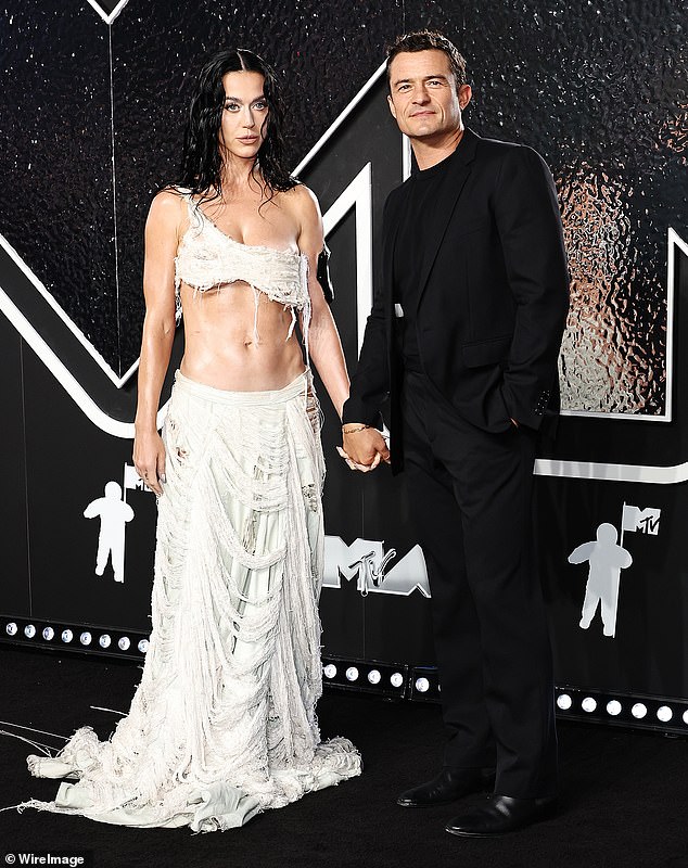 'Katy and Orlando have split but are amicable,' a source told Us Weekly , adding that the break-up was so far 'not contentious'; pictured together on September 11 in Elmont, New York