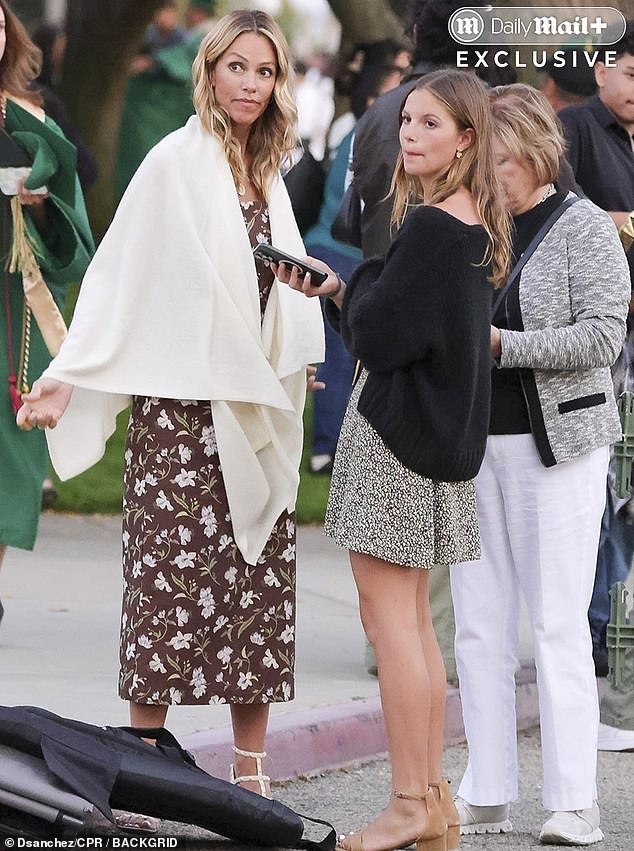 The Oscar-winning actor, 70, and the former handbag designer, 51, (pictured on left with the former couple's daughter Grace, 15) kept their distance at the event