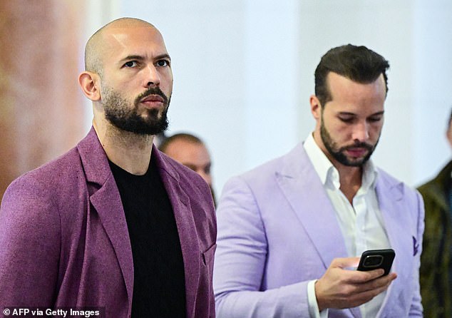 Andrew Tate (L) and his brother Tristan Tate are pictured inside The Court of Appeal in Bucharest, Romania, on December 10, 2024