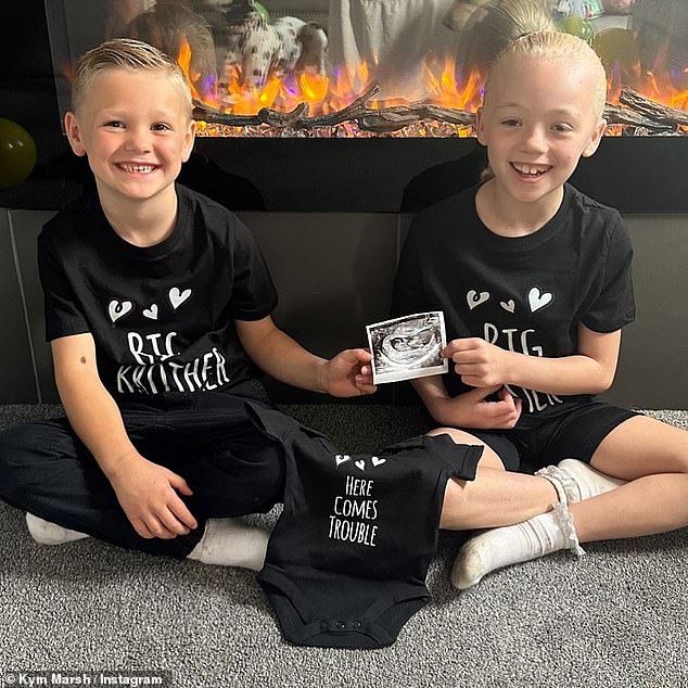 Kym said she was 'thrilled' with the news and shared a snap of the couple's son Teddy and Michel's daughter Polly proudly holding an ultra sound picture.