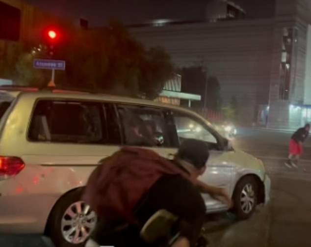 A people carrier drove at people full-speed, video showed, as protesters were seen hurling rocks at it