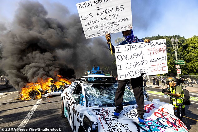 Rioters set fire to cars as part of their destructive protests