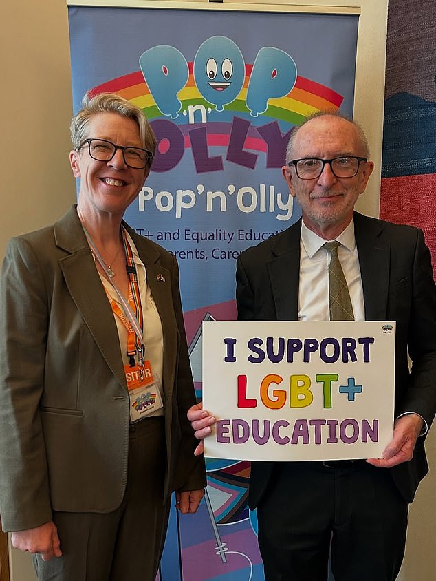 Labour MPs have shown support for an activist group which promotes 'transgender Cinderella' books to primary schools (pictured left to right: Mel Lane, head of education at Pop’n’Olly, with Paul Davies MP)