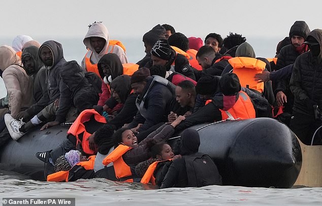 Migrants depart from the beach at Gravelines, northern France, on Saturday, on a day which witnessed the highest number of Channel arrivals in Dover for more than two and a half years