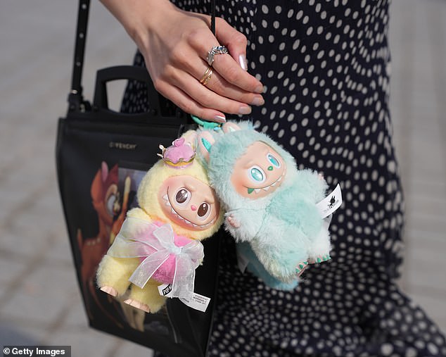 The toys, which originated in Hong Kong , are called Labubus - plush, furry little dolls that are described as 'elvish creatures,' with big teeth and elf-like ears (stock image)