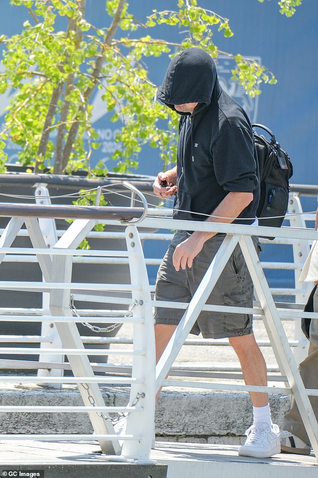 Leonardo DiCaprio continued his attempts to pass unrecognised as he departed Venice on Sunday morning, following Saturday night's final party of Jeff Bezos and Lauren Sanchez 's wedding extravaganza