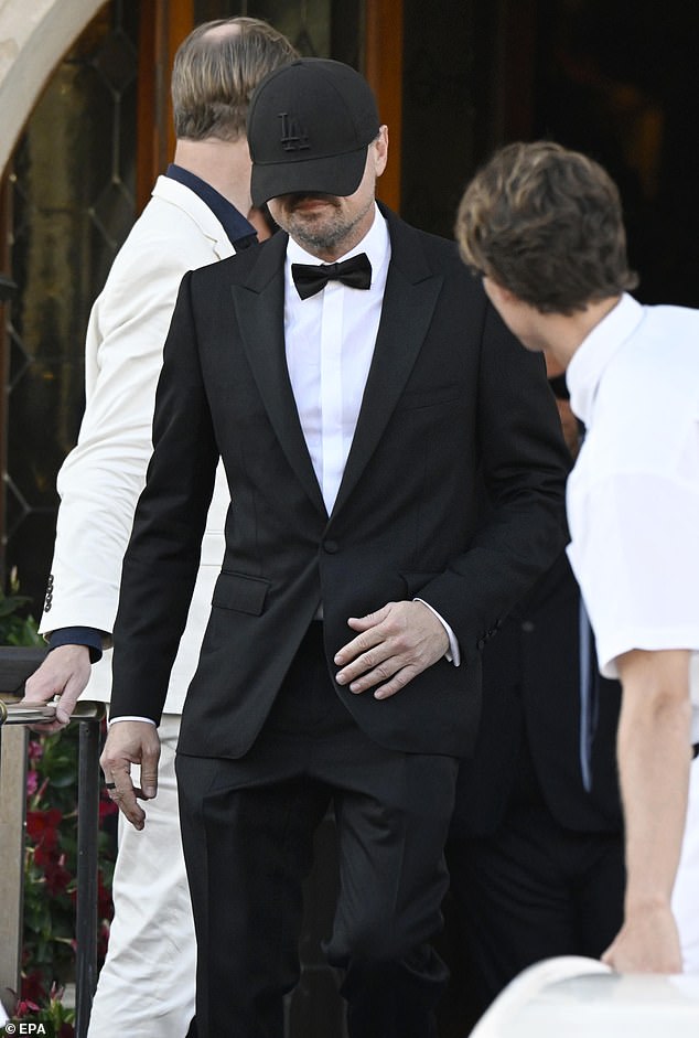 Leonardo DiCaprio was mocked over his bizarre penchant for a low sitting baseball cap as he attended Jeff Bezos and Lauren Sanchez' Venice wedding this week - pictured Friday at the nuptials