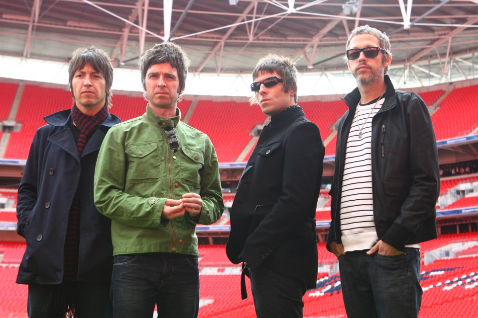 Oasis band members at Wembley Stadium.