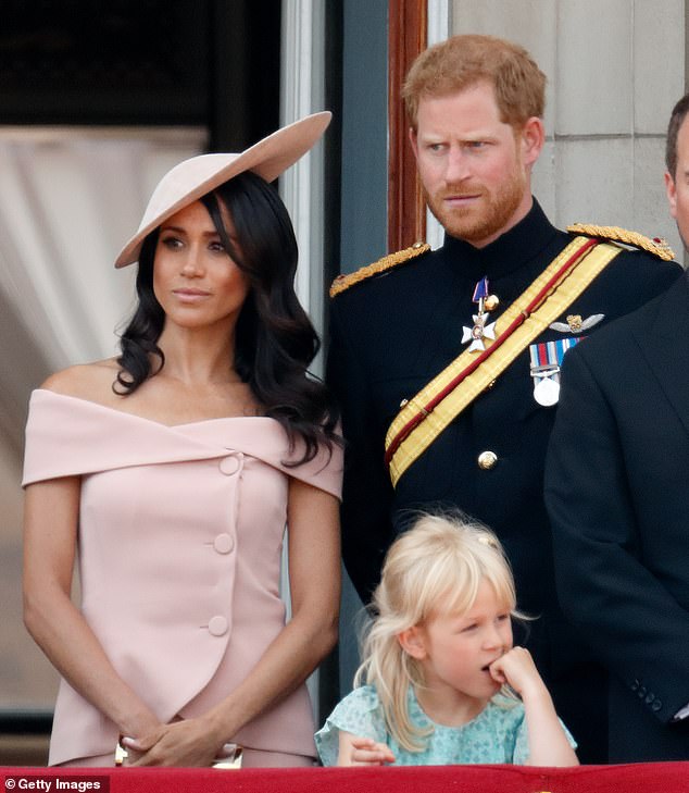 At one point, when Meghan was standing on the balcony, Prince Harry asked if she was doing OK