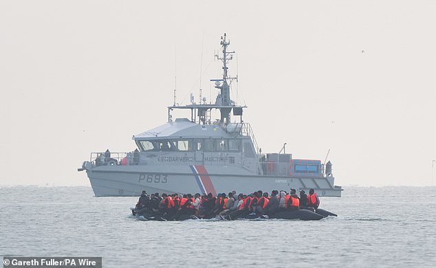 There are fears Lord Hermer's ignoring voters' immigration concerns is doing Reform's work. Pictured: A French coastguard boat is seen monitoring a boat packed with people