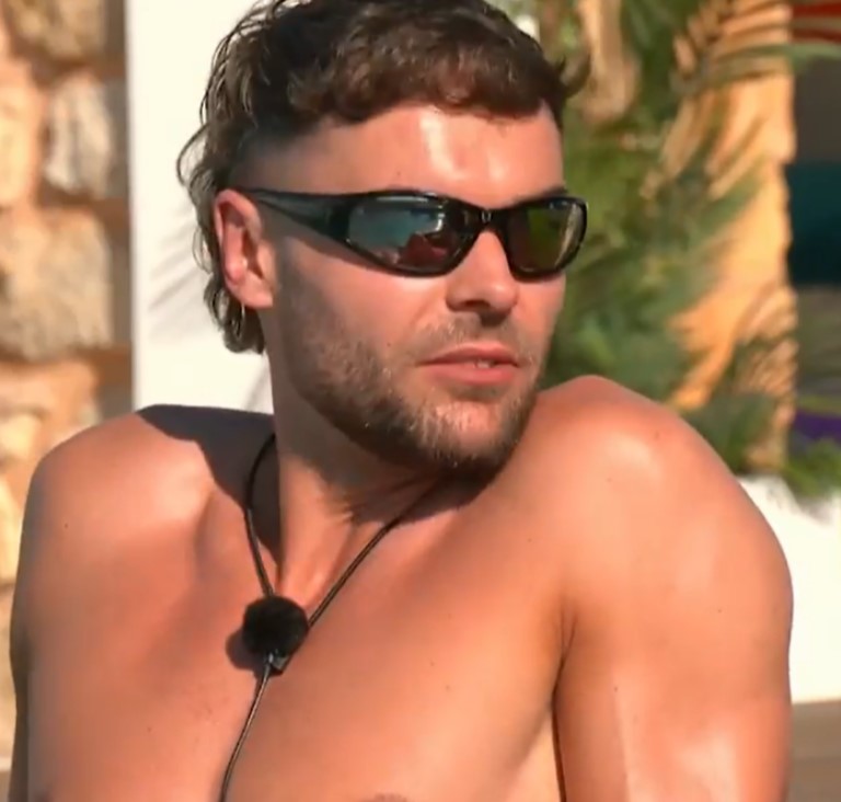 Man with sunglasses on Love Island.