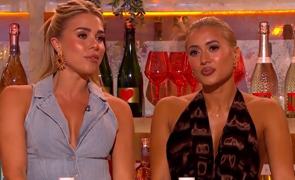 Two women sitting at a bar.