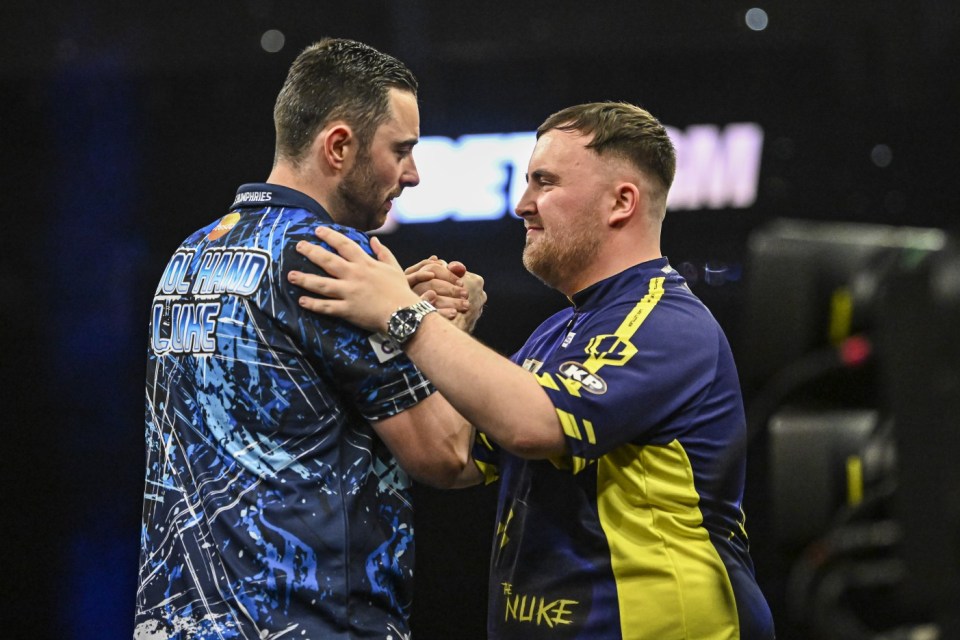 Mandatory Credit: Photo by Godfrey Pitt/Action Plus/Shutterstock (15325660co) Luke Littler congratulates his opponent Luke Humphries on his win in the final; O2 Arena, London, England; 2025 PDC Premier League Darts London, Play Offs. Premier League Darts, Play Offs, The 02 Arena, London, UK - 29 May 2025