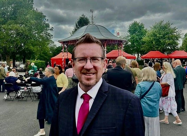 An MP who was suspended over a vile WhatsApp group has 'embarrassingly' admitted he edited a photo (pictured) to make it look like he attended Armed Forces Day