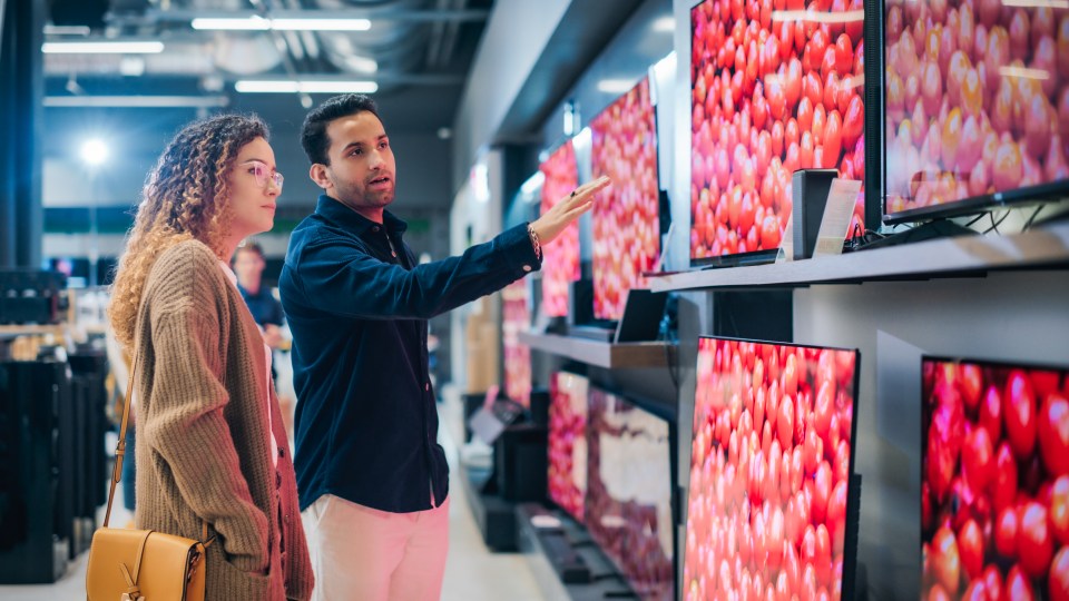 LG OLED TVs on display at a Best Buy electronics store.