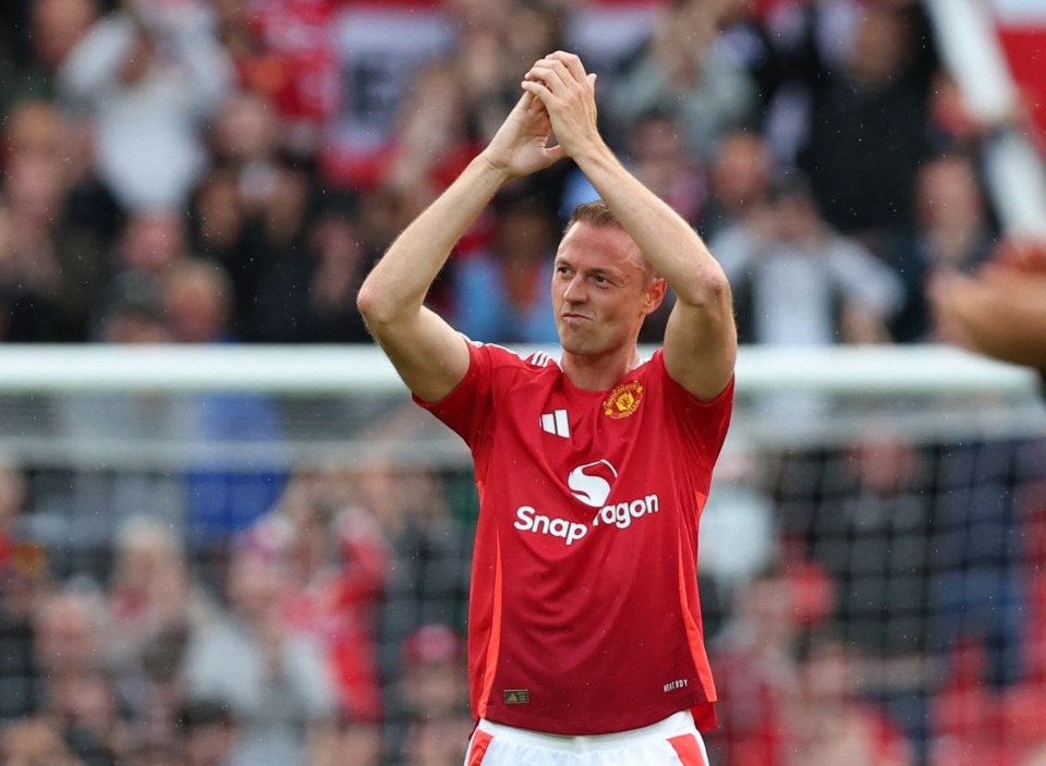 Jonny Evans of Manchester United applauding fans.