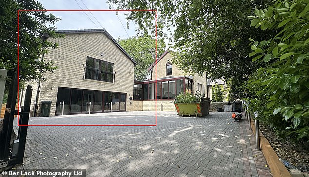Raziq Ali, 41, constructed this full-blown 'detached dwelling' with three floors and enough space for independent living