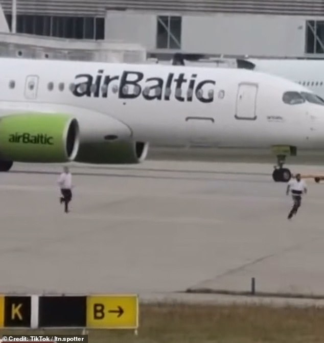 The man is seen being chased by staff at Heathrow airport on Sunday