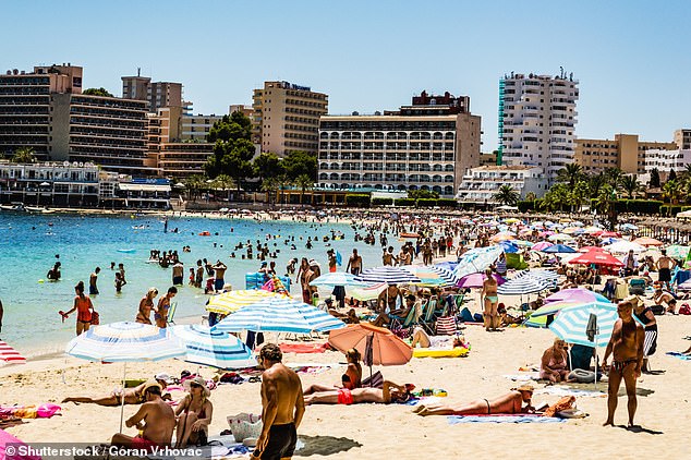 A married Irish woman has been arrested on suspicion of sexually assaulting a man at the spa of a Magaluf hotel. Pictured: Tourists enjoy a hot summer day at a Magaluf beach