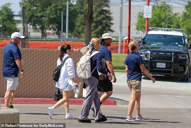 Hernandez was escorted into the stadium by an entourage of championship officials