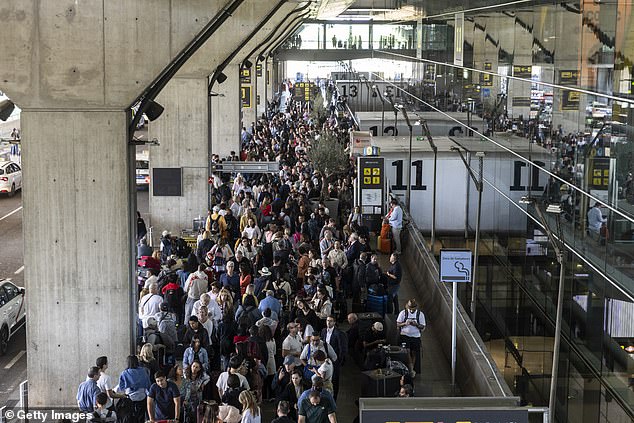 People queue for a taxi at Barajas Airport on April 28, 2025 in Madrid, Spain