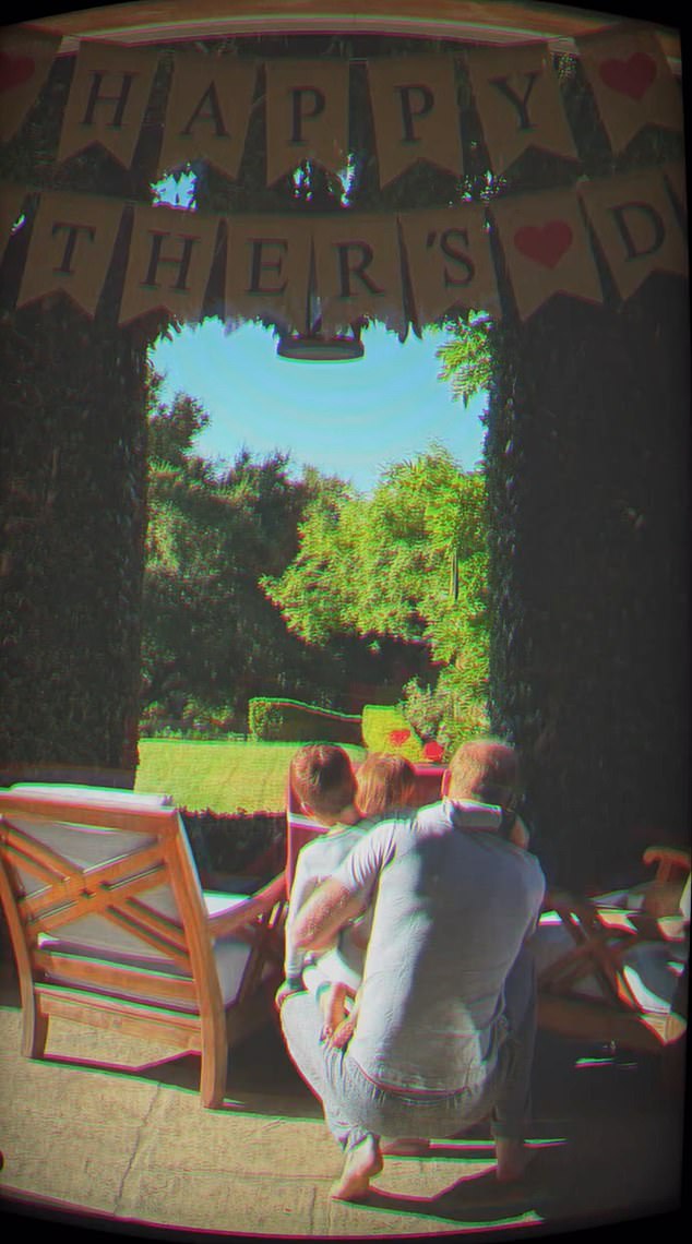 The Duchess of Sussex arranged for a Happy Father's Day banner to be put up in their garden in Montecito, California, where Harry could be seen clutching his two children tightly on his lap