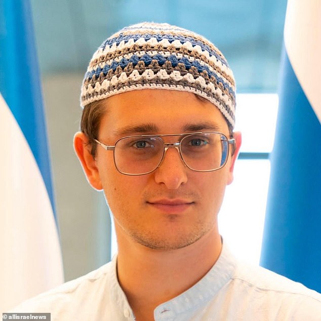 Trainee barrister Isaac Grand (pictured), 22, accused the Met of 'two-tier policing' after they escorted him away whilst protesters chanted 'Zionist scum' at him