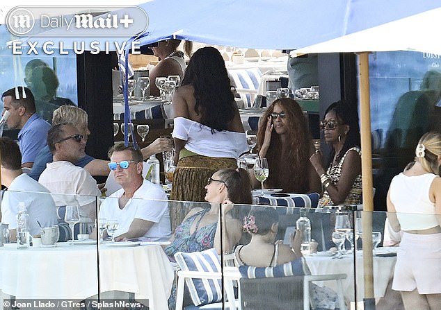 Michelle Obama and her daughters were pictured enjoying lunch at an exclusive club on the idyllic Spanish island of Mallorca.