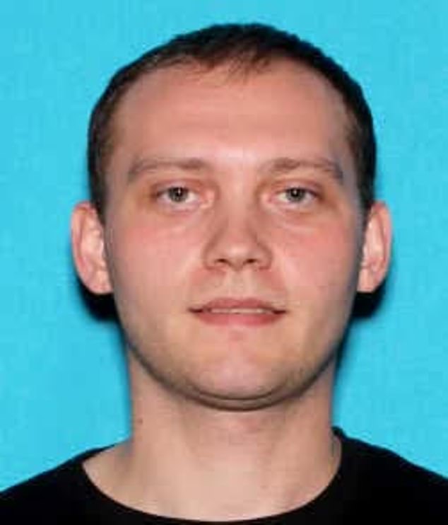 Brian Browning, 31, was shot dead by security guards after he opened fire on CrossPointe Church in Wayne, Michigan, on Sunday morning. His driver's license photo is pictured