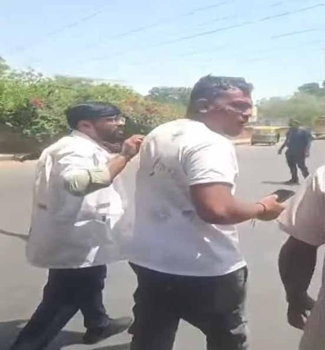 Astonishing footage showed the man walking away from the scene with some visible injuries to his face