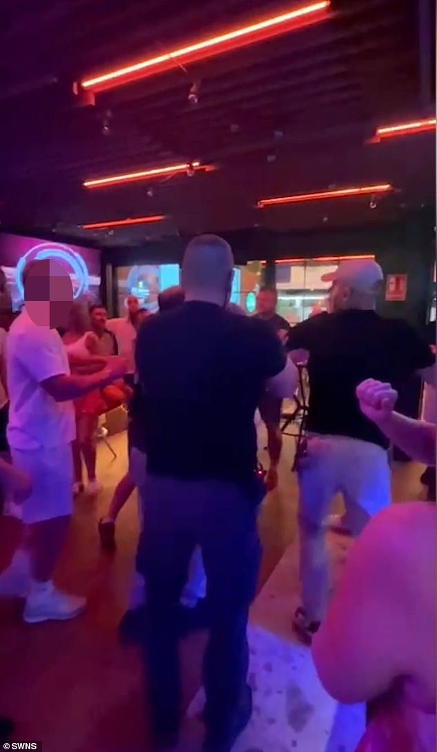 A British tourist was violently sucker-punched by a Spanish local after getting caught up in a brawl in a Benidorm bar