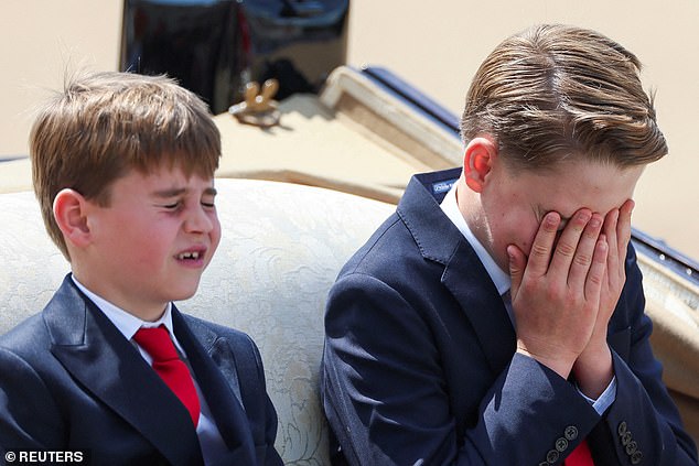 Taking a moment to himself, Prince George covered his eyes with his hands