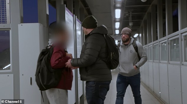 The fare evading passenger (left) is confronted by investigators at Harold Wood in East London