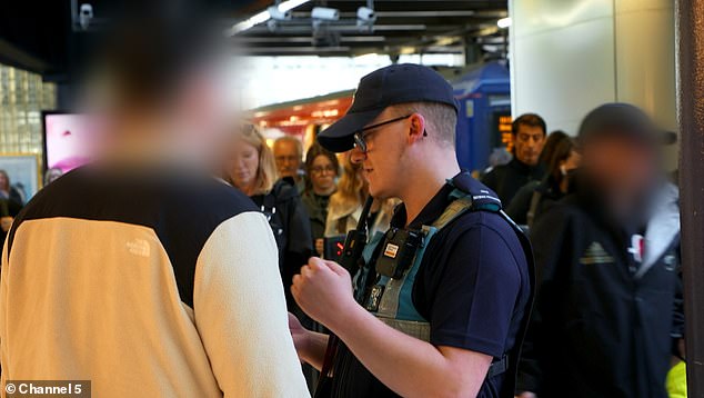 A South Western Railway revenue protection officer confronts a man at London Waterloo