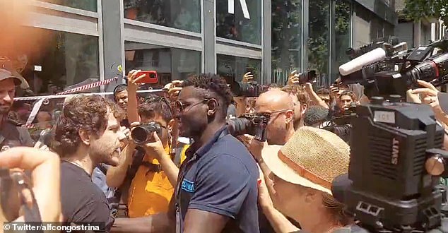 A furious hotel worker fought back against a crowd of anti-tourism protesters who tried to seal off his workplace in Barcelona