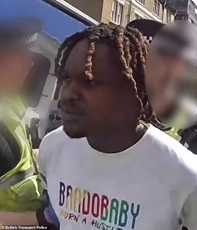 Tube killer Rakeem Miles as he was apprehended on August 23 last year - after punching an AI engineer who had brushed past him in a station