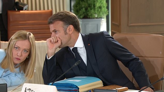 Emmanuel Macron was caught on camera whispering to Giorgia Meloni at the G7 roundtable