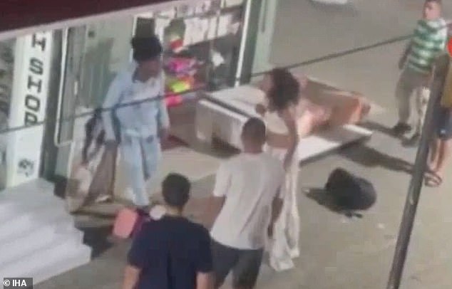 Onlookers had gathered to see the commotion as the argument broke out outside a shop