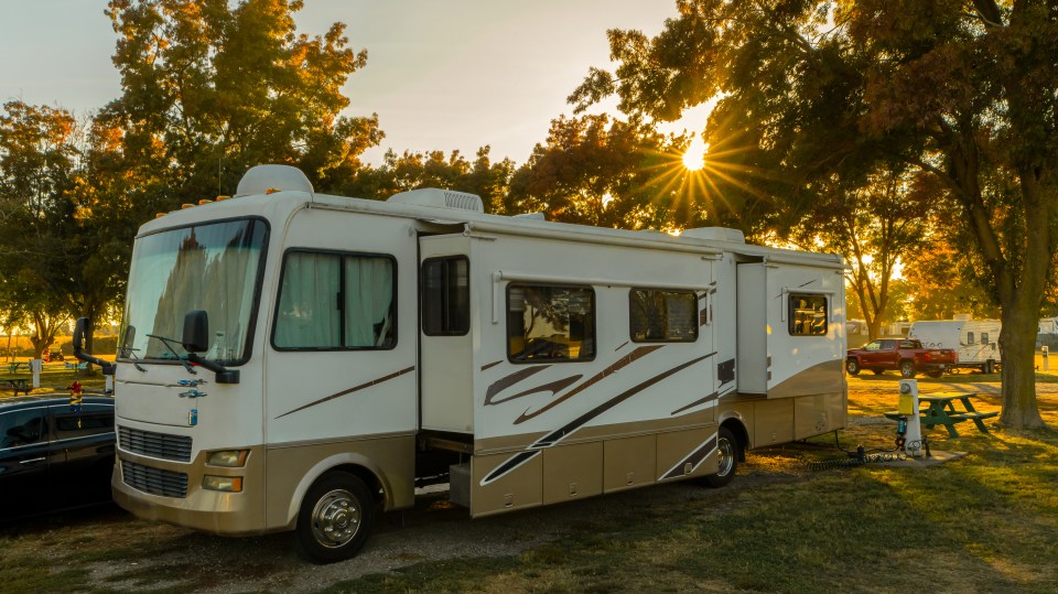 Motorhome parked at a campsite.