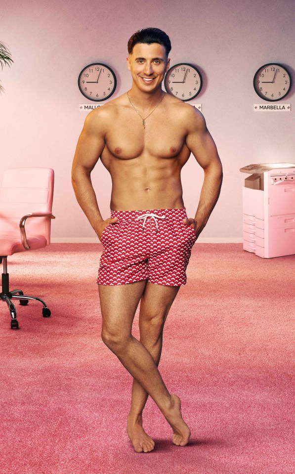 Tommy from Love Island, Series 12, in red swim shorts.
