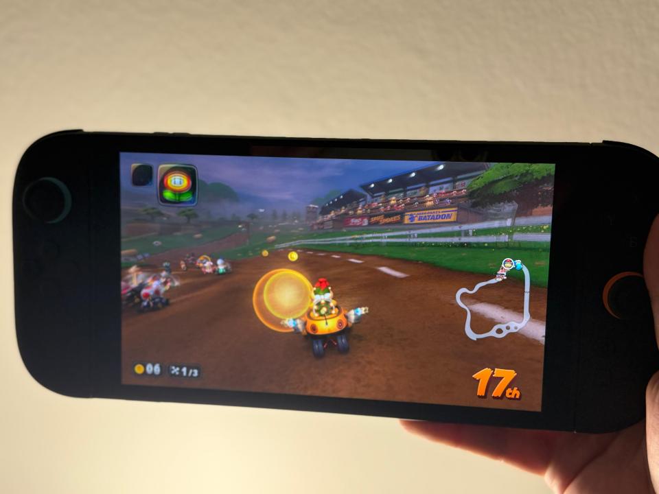 Gameplay screenshot of a kart racing game on a handheld device.