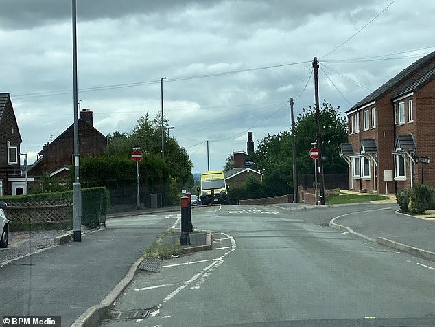 Photos taken at Woodland Street in Biddulph, North Staffordshire, show an ambulance parked where emergency services arrived on scene yesterday afternoon