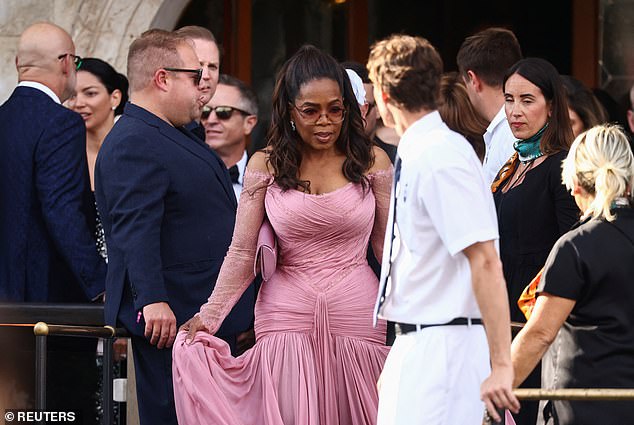 The former talk show host, was a vision in a fitted dusty pink gown, which featured her cinched waist following her 50 pound weight loss